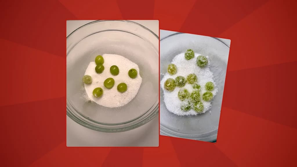 green grapes being rolled in sugar and edible glitter