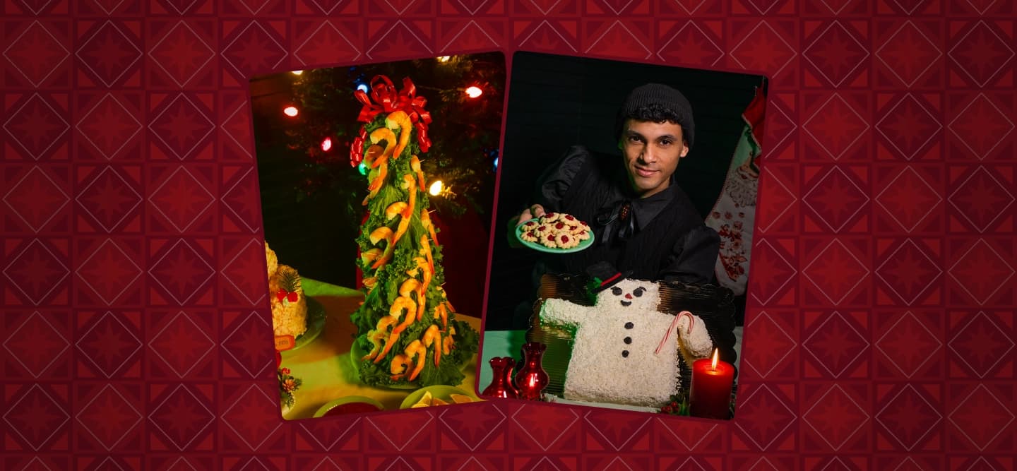 A mid-century style holiday scene showing a shrimp Christmas tree centerpiece and a coconut-covered snowman cake displayed on a festive table.