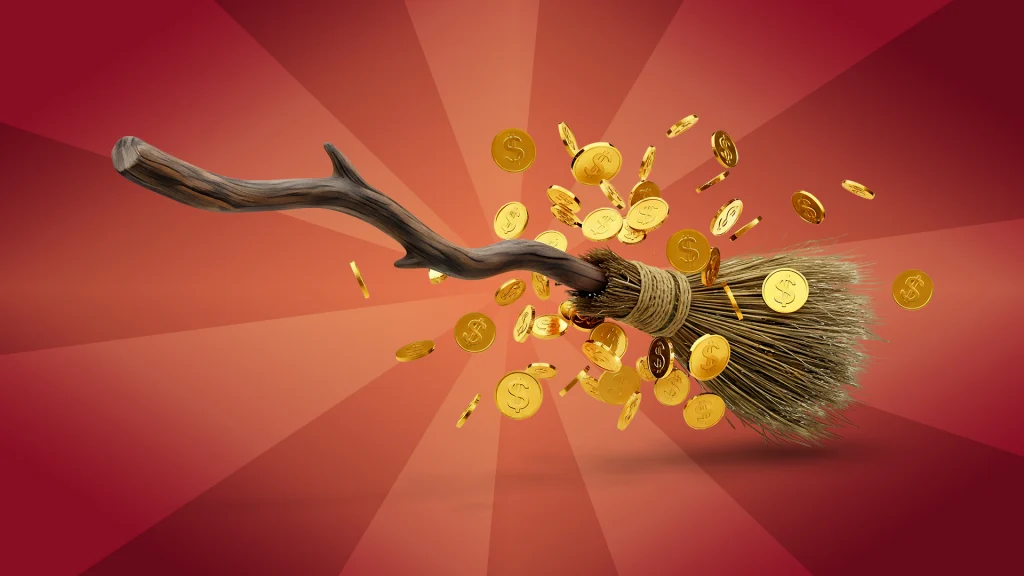 A broom flies into a red/orange background, bursting through a sea of gold coins. 