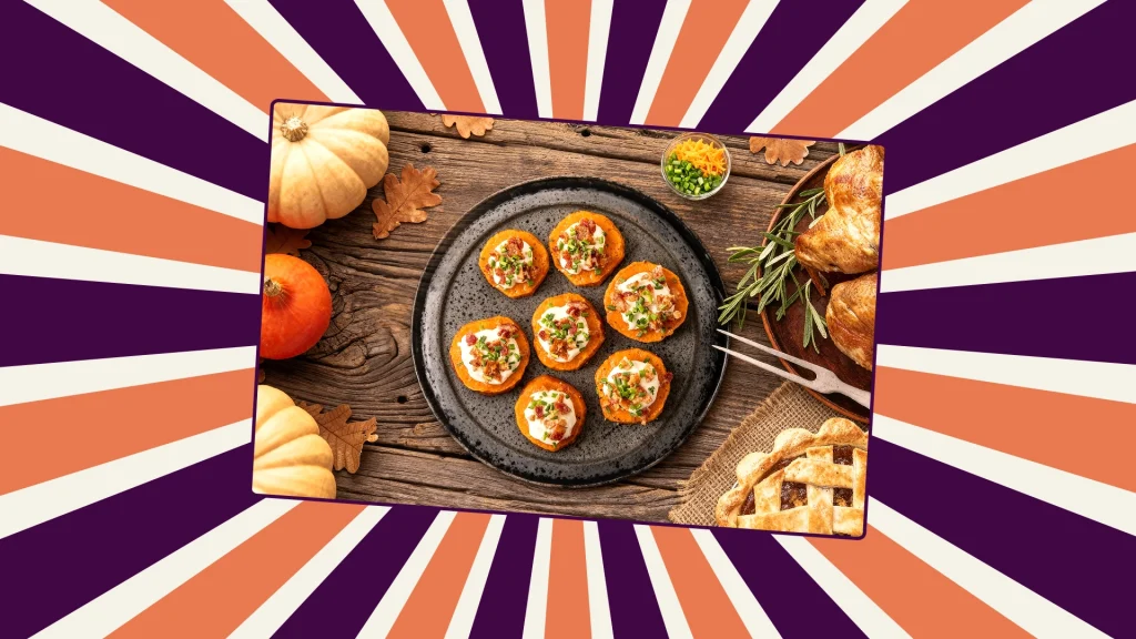 6 Sweet potato rounds topeed with goat's cheese and other garnishes sit on a plate on top of a wooden table
