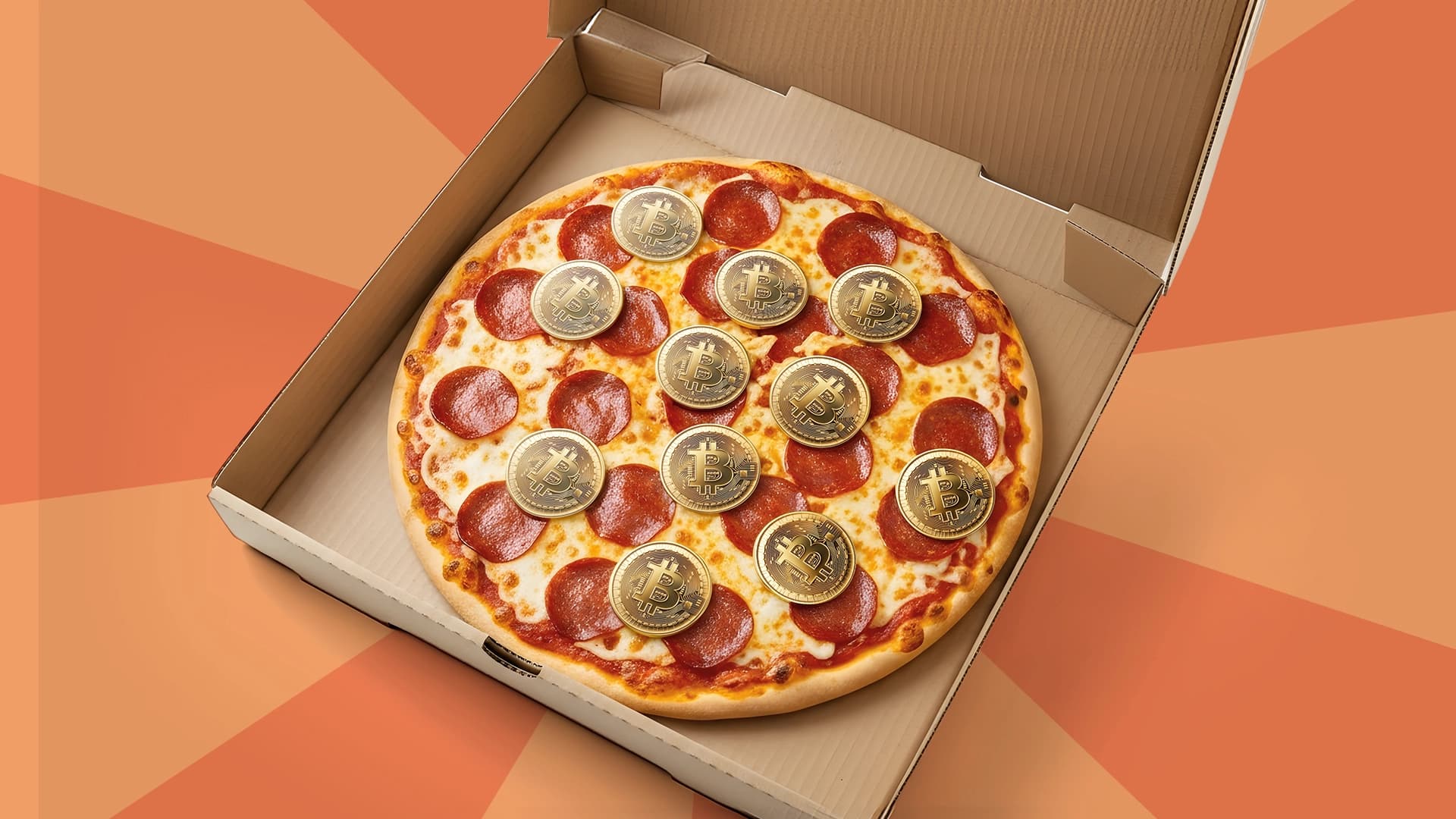 a peperoni pizza with bitcoin coins on top