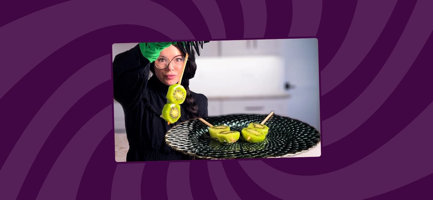 hunger diaries holds up her Kiwi Tanghulu in wicked costume