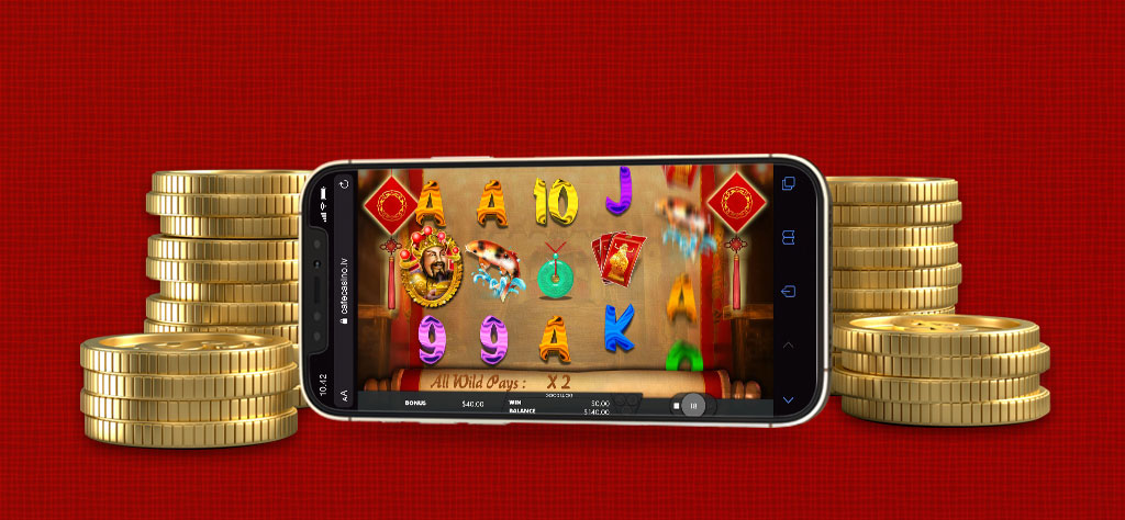 Caishen’s Fortune XL online slots game displayed on a mobile phone, surrounded by gold coins.
