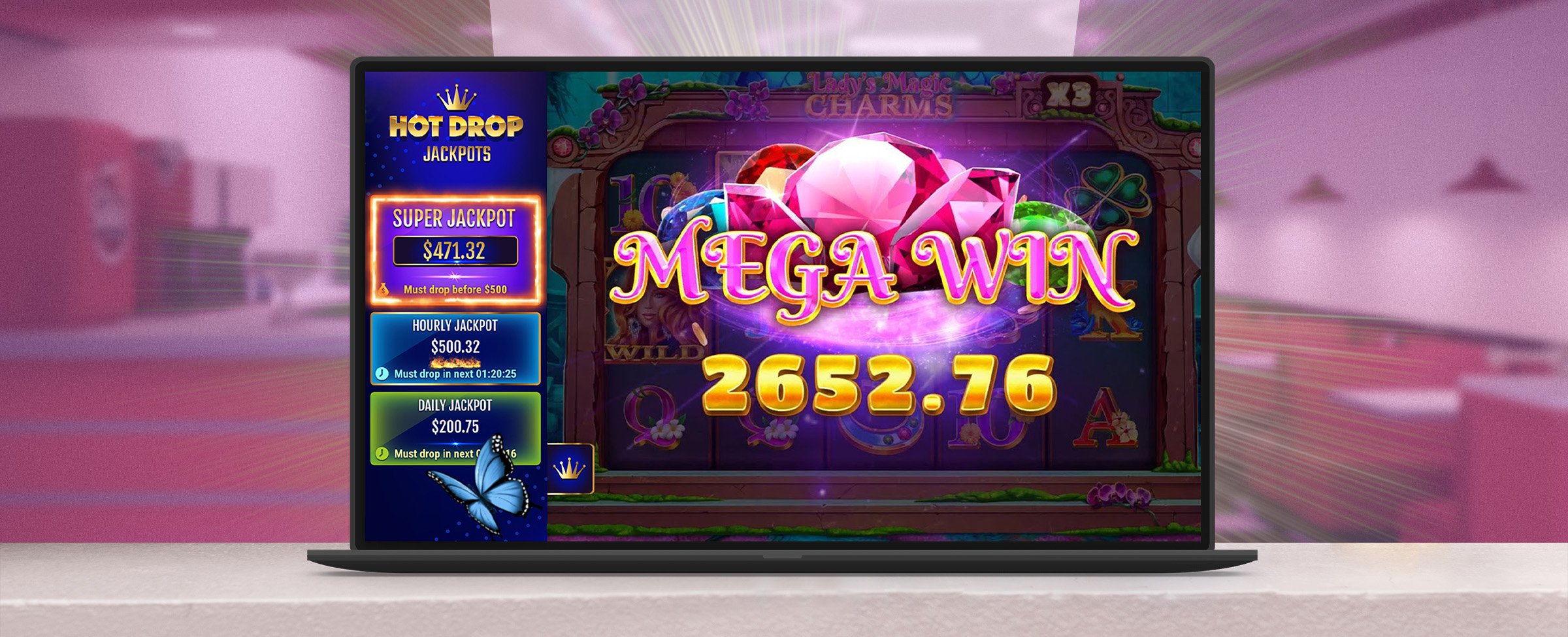 A laptop appears on a white countertop in a 50s diner showing the game play from Cafe Casino’s Lady’s Lucky Charms, featuring jewels and the words Mega Win.