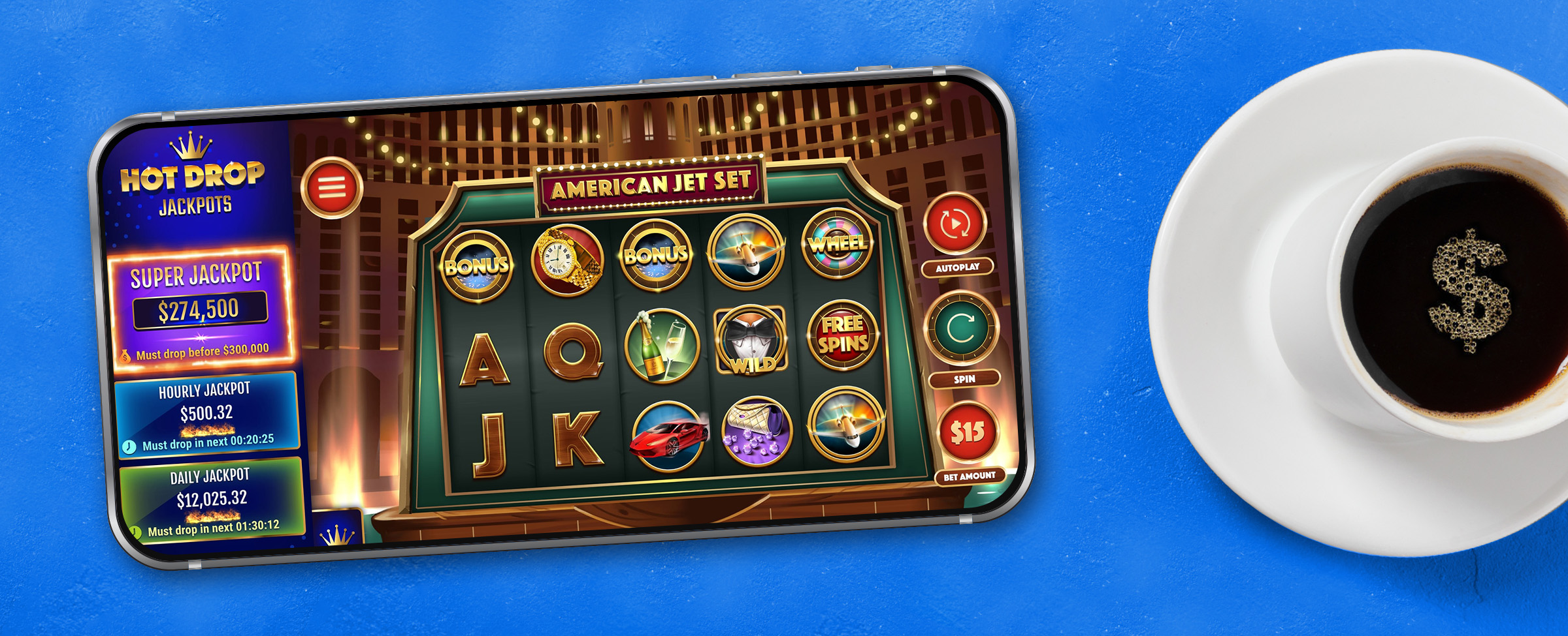 A mobile phone lays flat on a blue table surface, showing a screenshot of the Cafe Casino slot game American Jet Set Hot Drop Jackpots, while a coffee cup with black coffee and a gold-sprinkled dollar sign sits on a white saucer.
