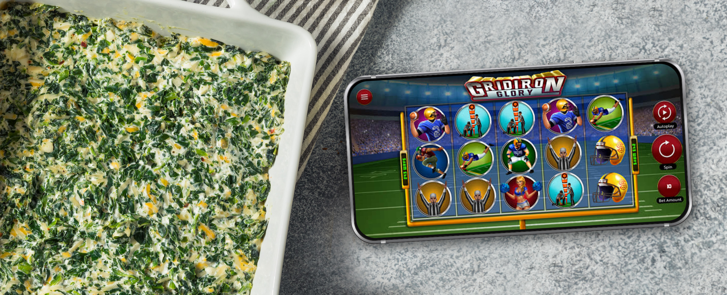 A mobile phone showing a screen from the Cafe Casino slot game ‘Gridiron Glory’ sits on a table to the right of a dish with baked spinach dip.