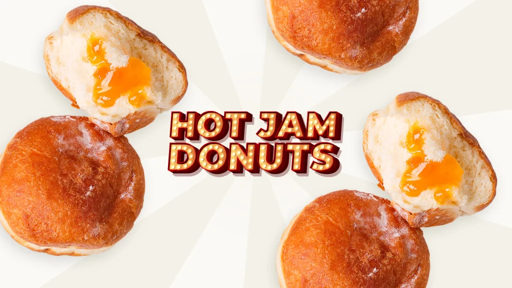 Donuts with a yellow jam center sit on a white background with the words 'Hot Jam Donuts' in the middle.