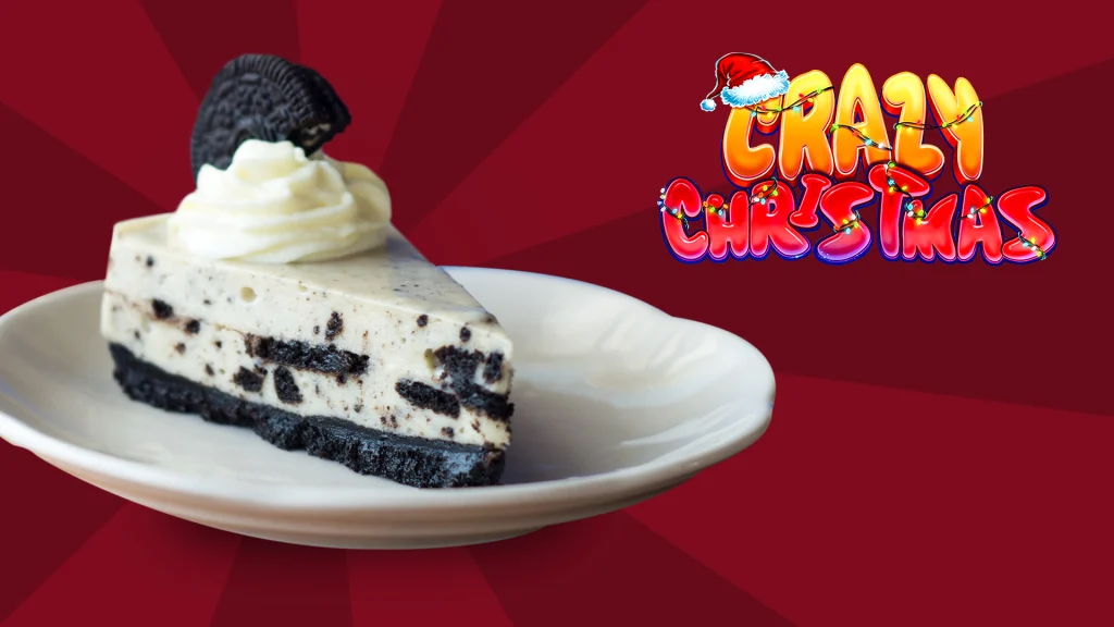 A slice of ice cream Oreo cake on a plate next to the Crazy Christmas slots game logo, against a red background.
