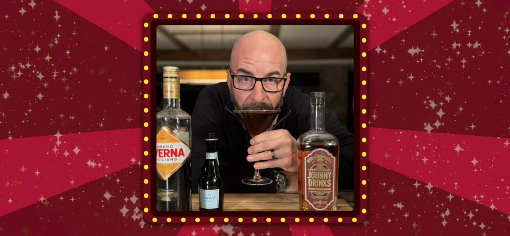 Johnny Drinks sips on a Fresh Start Cocktail, with bottles of Rum, Averna and Prosecco in front.
