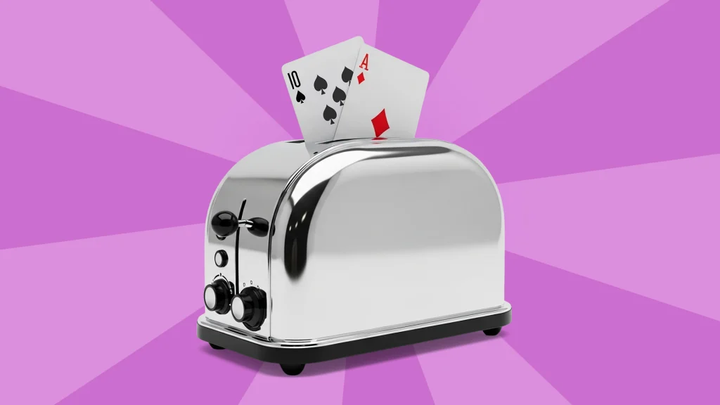 On a light purple background, a toast pops up a 10 and Ace playing cards.